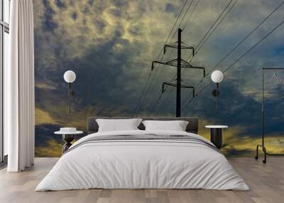 Electricity power lines against a sunset sky Wall mural