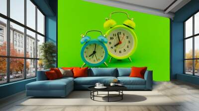 Twin bell analog alarm clock over green background Wall mural