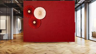 Chinese new year festival or wedding decoration over red background. Traditional lunar new year paper fans. Flat lay, top view, banner Wall mural