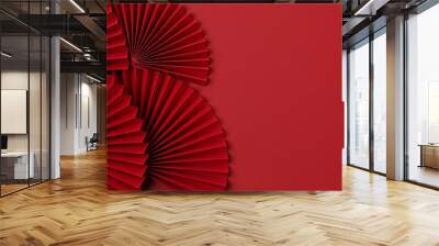 Chinese new year festival or wedding decoration over red background. Traditional lunar new year paper fans. Flat lay, top view, banner Wall mural