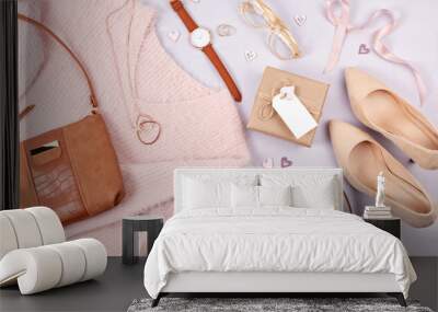 Flat lay of woman clothing and accessories in pastel colors Wall mural