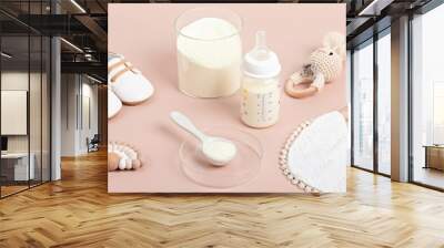 Preparation of formula for baby feeding. Baby health care, organic mixture of dry milk concept. Wall mural