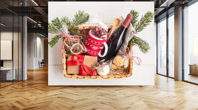 Refined Christmas gift basket for culinary enthusiats with bottle of wine and mulled wine ingredients. Corporate hamper or personal present for cooking lovers, foodies and gourmands. Wall mural