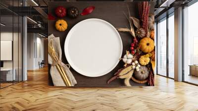 Rustic menu mockup with plate and autumn table decoration.  Floral interior decor for fall holidays with handmade pumpkins. Holiday dinner concept. Flatlay, top view. Wall mural