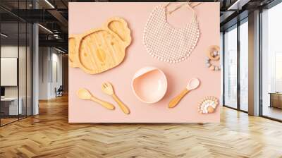 Top view of baby dishware. First safe plate and tableware for baby and toddler. Flat lay, mockup Wall mural