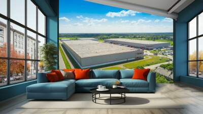 Aerial Shot of Industrial Warehouse Area where Many Trucks Are Loading Merchandise. Wall mural