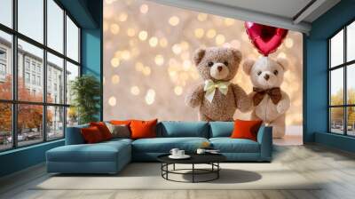 bear holding a heart shaped balloon on light background with copy space. Valentine's Day. Wall mural