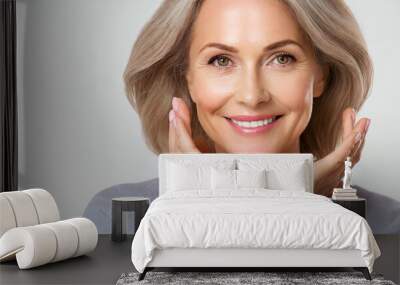 Beautiful gorgeous 50s mid aged mature woman looking at camera isolated on white. Mature old lady close up portrait. Healthy face skin care beauty, middle age skincare cosmetics, cosmetology concept Wall mural