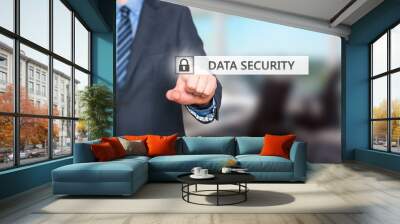 Businessman pressing data security button on virtual screen Wall mural