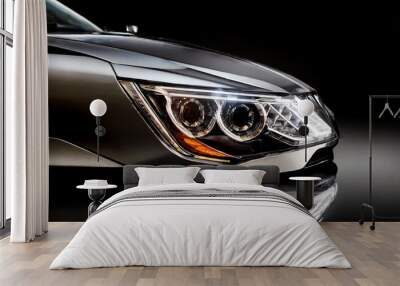 Detail on one of the LED headlights modern car on black background, Wall mural