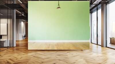 Light green wall in an empty room with a wooden floor Wall mural