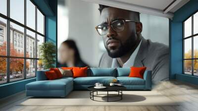 Black businessman leading a team in a strategic meeting focused on planning for increased profitability Wall mural