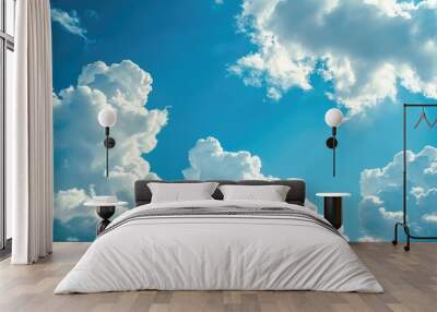 Soft white clouds in the luminous blue sky Wall mural