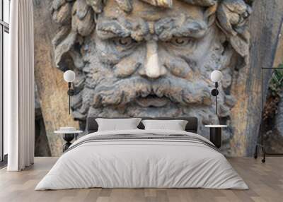 Old relief bar, a keystone in a building arch, of an old bearded man face in the historical downtown of Dresden, Germany, details Wall mural