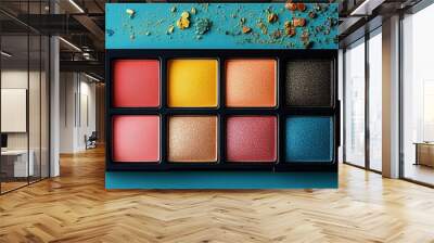 Colorful eyeshadow palette and professional makeup brushes on a blue background. Beauty and makeup concept with copy space for cosmetics design and tutorials. Wall mural