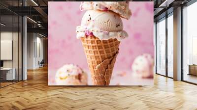 Waffle cone with two strawberry scoops of ice cream, with chocolate chips against a pink background. Dessert and summer treat concept. Image for ice cream shop advertising and menu. Wall mural