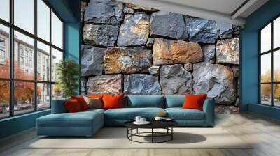 A close-up view of a textured stone wall showcasing various sizes and colors of natural stones, perfect for architectural and design projects.  Wall mural