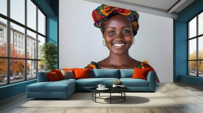 Mobile money in Africa. Mpesa. A joyful African woman wearing a colorful traditional headwrap and attire holds a smartphone, radiating positivity and Wall mural