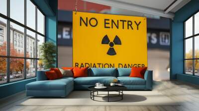 Yellow radiation warning and hazard sign forbidding entry to a radioactive zone Wall mural