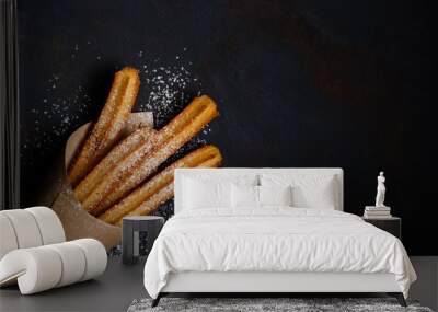 churros sticks fresh hot in paper bag on dark background with copy space Wall mural