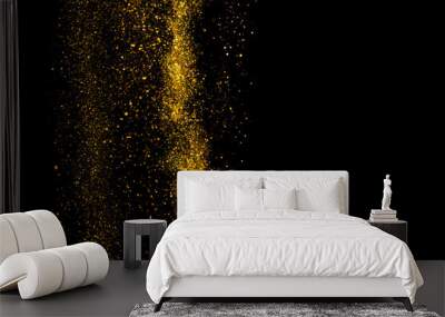 Gold glitter dust falling isolated on black background border design element with copy-space Wall mural