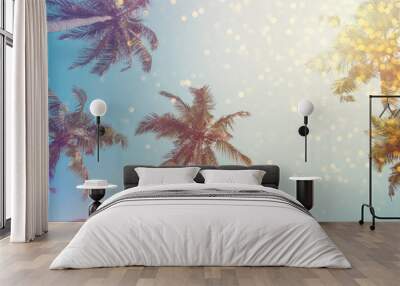 Palm trees vintage toned with shiny party bokeh lights effect Wall mural