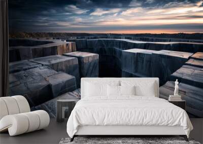 A breathtaking view of a stone quarry at sunset, showcasing dramatic contours and contrasting colors in the landscape. Wall mural