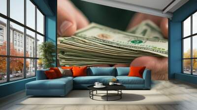 A close-up of hands holding a stack of cash, symbolizing wealth, investment, and financial success in a modern, vibrant context. Wall mural