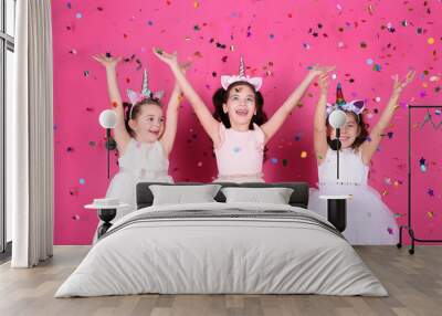 Adorable little children and falling confetti on pink background Wall mural