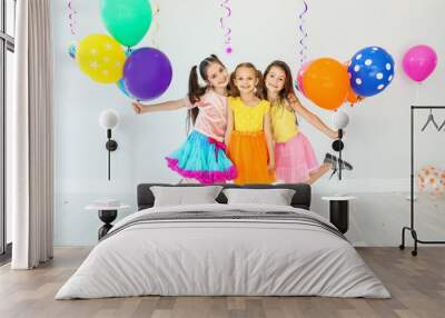 Adorable little girls at birthday party indoors Wall mural