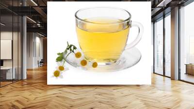 Aromatic herbal tea in glass cup and chamomiles isolated on white Wall mural