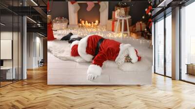 Authentic Santa Claus lying on floor indoors Wall mural