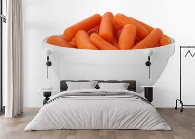 Baby carrots in bowl isolated on white Wall mural