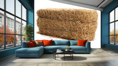 Bale of dried straw isolated on white Wall mural