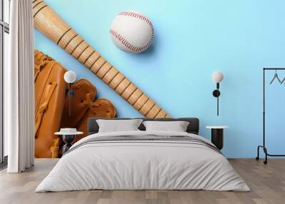 Baseball glove, bat and ball on pale light blue background, flat lay. Space for text Wall mural