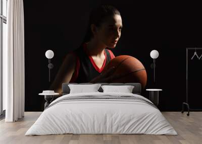 Basketball player with ball on black background Wall mural