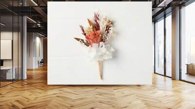 Beautiful boutonniere on white background, top view Wall mural