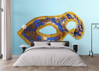 Beautiful bright carnival mask on light blue background Wall mural