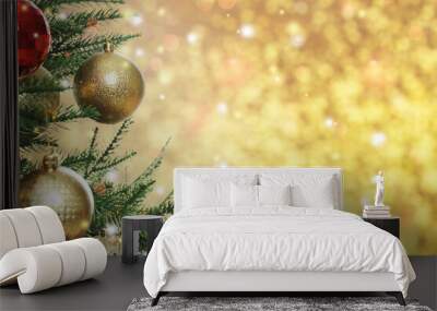 Beautiful Christmas tree with bright baubles on blurred golden background, closeup. Space for text Wall mural