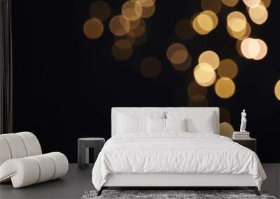 Beautiful golden lights on dark background. Bokeh effect Wall mural