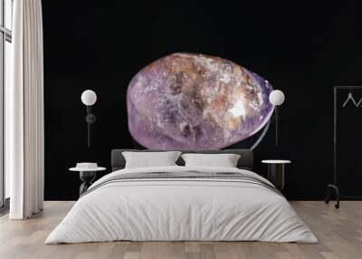 Beautiful light purple ametryn gemstone on black background Wall mural