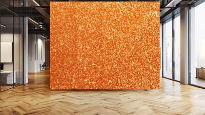 Beautiful shiny orange glitter as background, closeup Wall mural