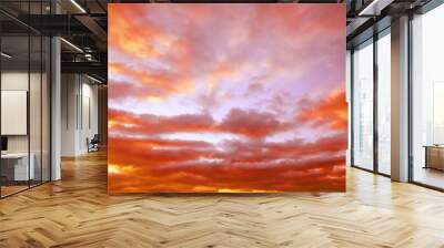 Beautiful view of orange sky with clouds at sunset Wall mural