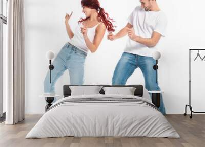 Beautiful young couple dancing on white background Wall mural