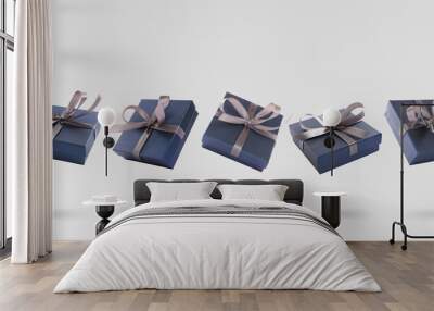 Beautifully wrapped gift boxes flying on light background Wall mural