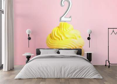 Birthday cupcake with number two candle on pink background Wall mural