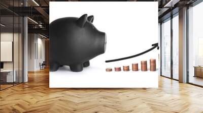 Black ceramic piggy bank and coins on white background Wall mural