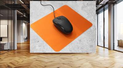 Blank pad and modern computer mouse on table Wall mural