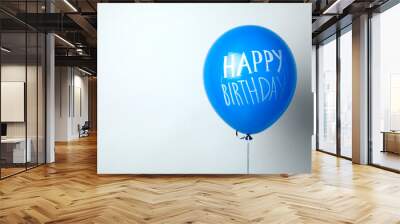 Blue balloon with words HAPPY BIRTHDAY on white background Wall mural