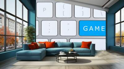 Blue button with word GAME on keyboard, top view Wall mural